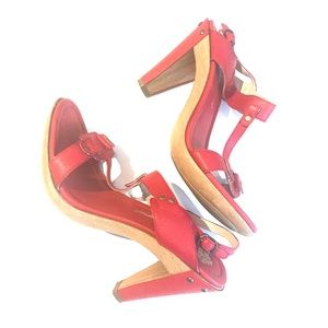 Red shoes with gold and faux wood detail. Size 8